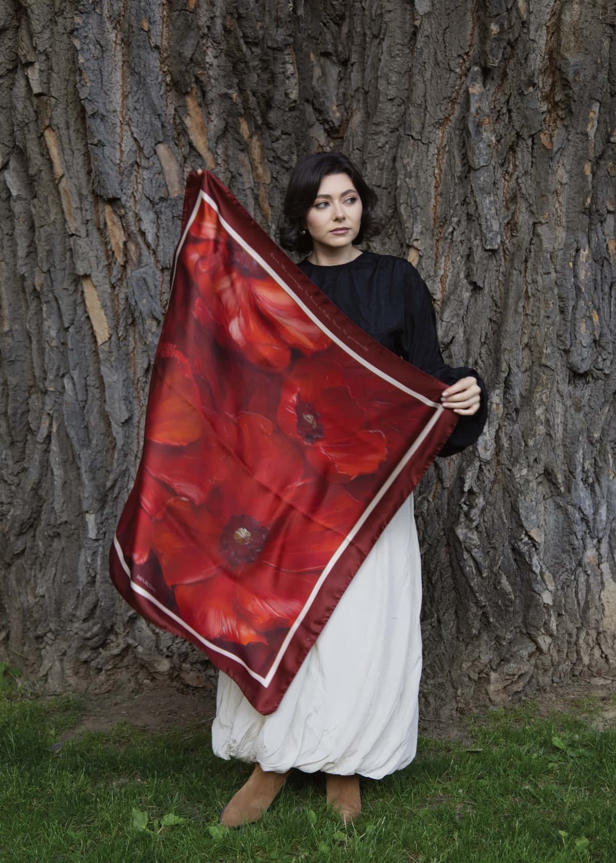 A picture of Maria, the founder of the Marlume brand, showing a large scarf size.